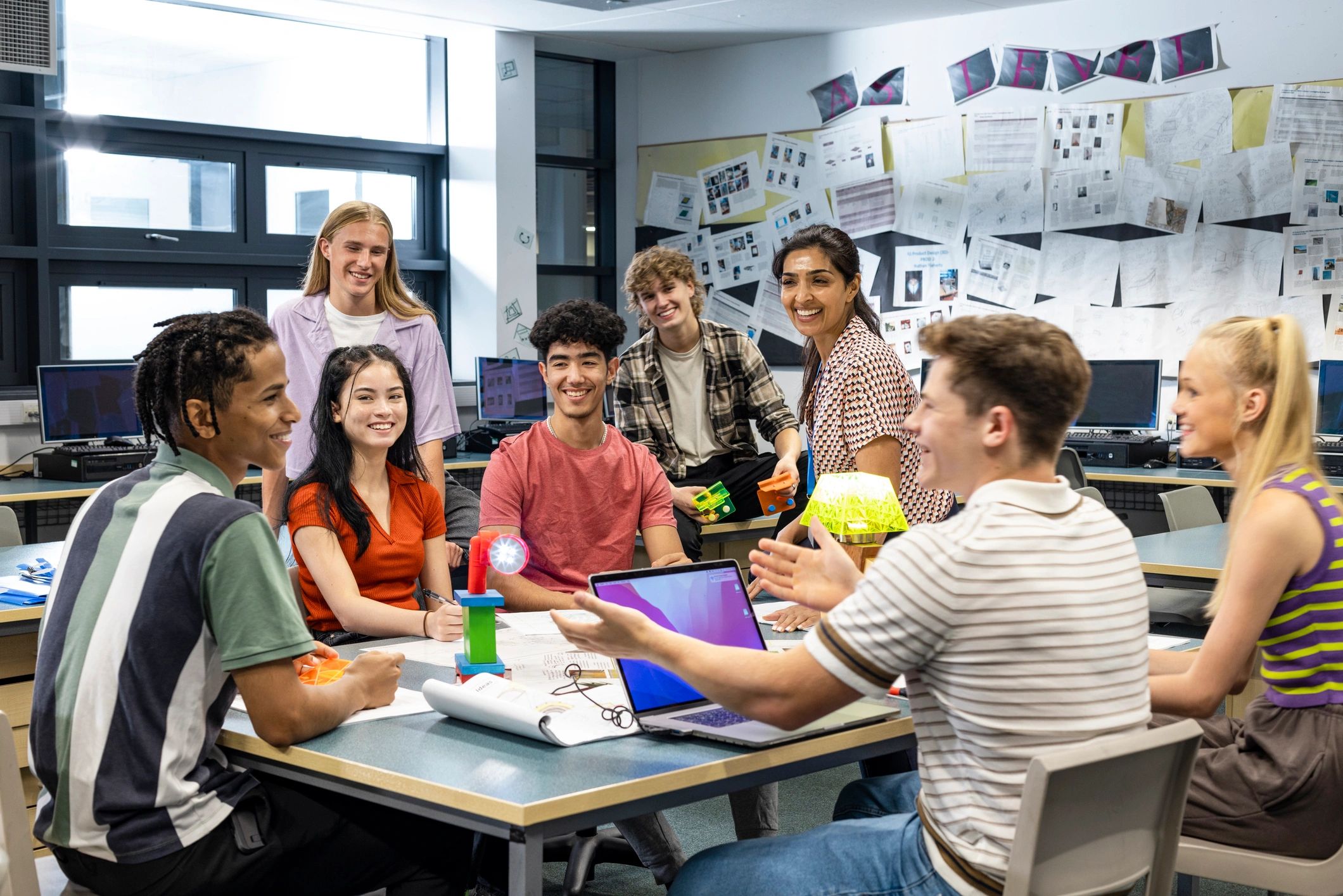 Teacher and students collaborating in class