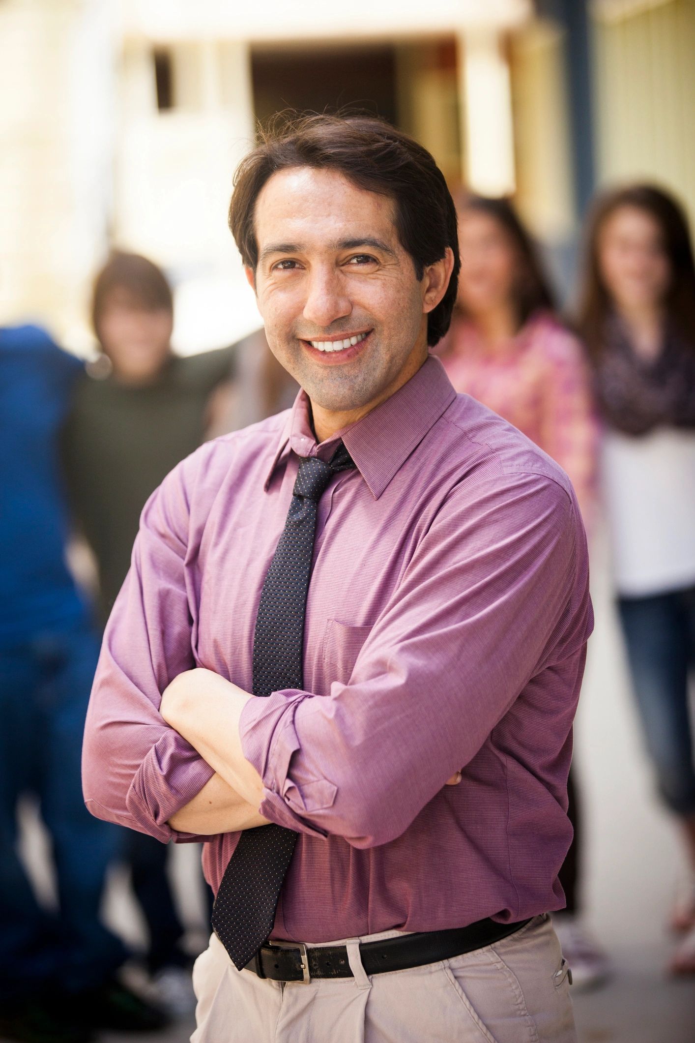 Professional educator standing on school campus