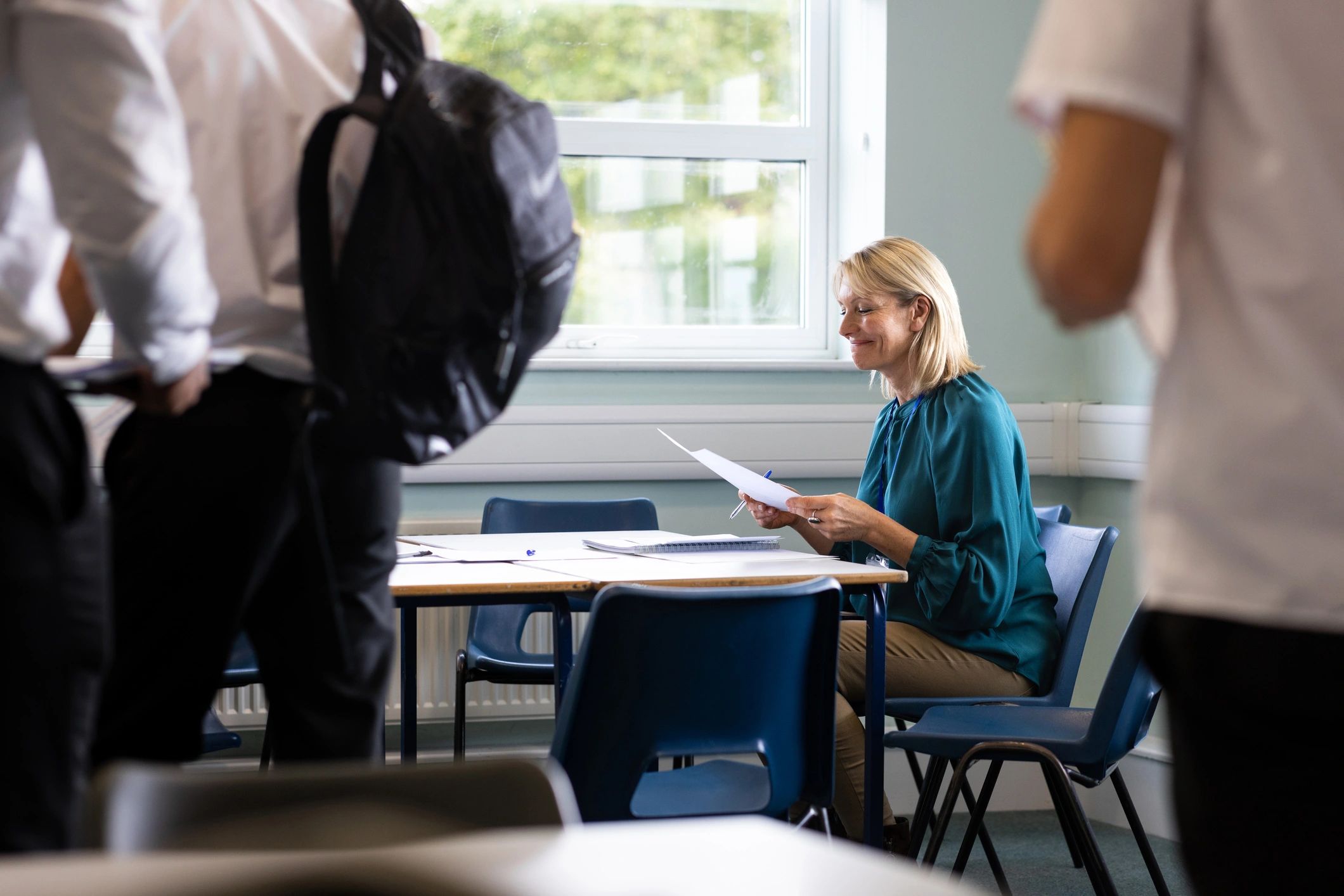 Teacher reviewing lesson materials